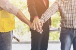 Business Team Putting Their Hands Together Stock Photo