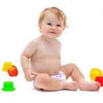 Cute Infant Boy With Toys Stock Photo