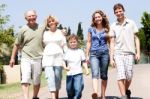 Extended Family Group Walking Down The Pathway Stock Photo