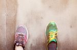 Foot With Shoes On Wall Stock Photo