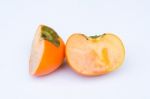 Persimmon Fruit Cut One Side Front Stock Photo