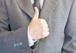 Business Hand Shows Thumb Up Stock Photo