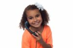 Little Girl Speaking Over Phone Stock Photo