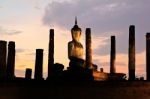 Ancient Buddha Statue At Twilight, Wat Mahathat In Sukhothai His Stock Photo