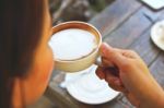 Young Woman Drinking Coffee Stock Photo