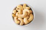 Raw Cashew Nut In White Bowl Stock Photo