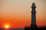 Lighthouse At Sunset Stock Photo