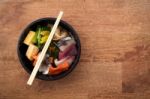 Japanese Food Tekka Don Take Away On Wooden Background Stock Photo