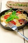 Spaghetti Pasta With Baked Cherry Tomatoes And Basil Stock Photo