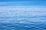 Blue Sea Water Surface On Sky Stock Photo