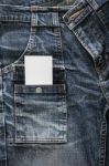 White Card On Blue Jeans Stock Photo