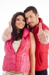 Young Couple Showing Thumbs Up Stock Photo