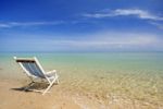 Sunlounger In Seashore Stock Photo