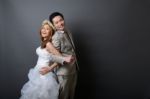 Young Asian Groom And Bride Posing And Smiling In Studio For Pre Stock Photo