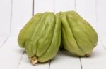 Chayote Fruit On White Wood Background Stock Photo