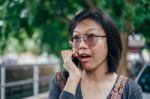 Woman Calling With Mobile Phone Disappointed On Somethings Stock Photo