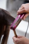 Straightening Hair Stock Photo