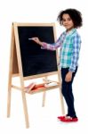 Happy Schoolchild Writing On Blackboard Stock Photo