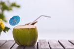 Coconut Water Drink Served In Coconut With Drinking Straw On The Stock Photo