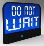 Do Not Wait Clock Shows Urgency For Action Stock Photo