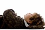 Teenage Boy Lying On Floor Stock Photo