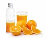 Orange Juice In The Plastic Bottle And Glass Stock Photo