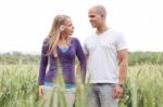 Romantic Walk By A Young Couple Stock Photo