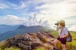 Hiker Teen Girl Holding A Camera For Photography Stock Photo