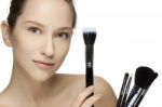 Portrait Of The Beautiful Woman With Make-up Brushes Stock Photo