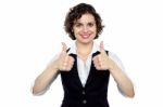 Pretty Lady Gesturing Double Thumbs Up Stock Photo