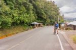 Man, On The Bicycle On The Road In Nicaragua Mountains Stock Photo