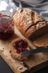 Dark Multigrain Bread Whole Grain And Jam Fresh Baked On Rustic Closeup Stock Photo