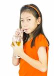 Asian Young Girl Drinks Orange Juice Stock Photo