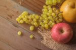 Apples And Grapes On The Table Stock Photo