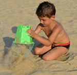 Kid On The Beach Stock Photo