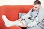 Man With Broken Leg Stock Photo