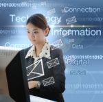 Businesswoman Typing On desktop Stock Photo