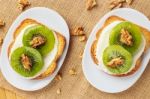 Toast With Kiwi, Cheese And Walnuts Stock Photo