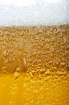 Close-up Picture Of A Beer With Foam And Bubbles Stock Photo