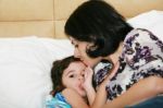 Mother Kissed Her Little Baby, Close-up Stock Photo