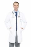 Young Doctor Posing With Hands In His Overcoat Stock Photo