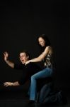 Funny Young Couple Play In Studio Stock Photo