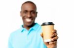 Smiling Man Holding Beverage Cup Stock Photo