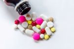 Top View Of The Pills On The White Background, The Drug And Capsule Pills On The Floor Stock Photo