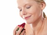 Young Lady Holding A Strawberry Stock Photo