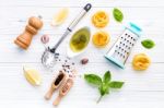 The Ingredients For Homemade Pesto Pasta On White Wooden Backgro Stock Photo