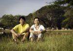 Happy Couple Posing For A Portrait In Park Stock Photo