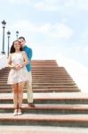 Young Lovers Hugging On Stairs Stock Photo