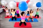 Group Of People Doing Pilates In A Gym Stock Photo