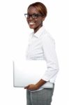 Businesswoman Carrying Laptop Stock Photo